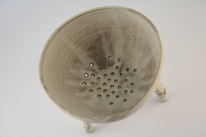 White ceramic strainer