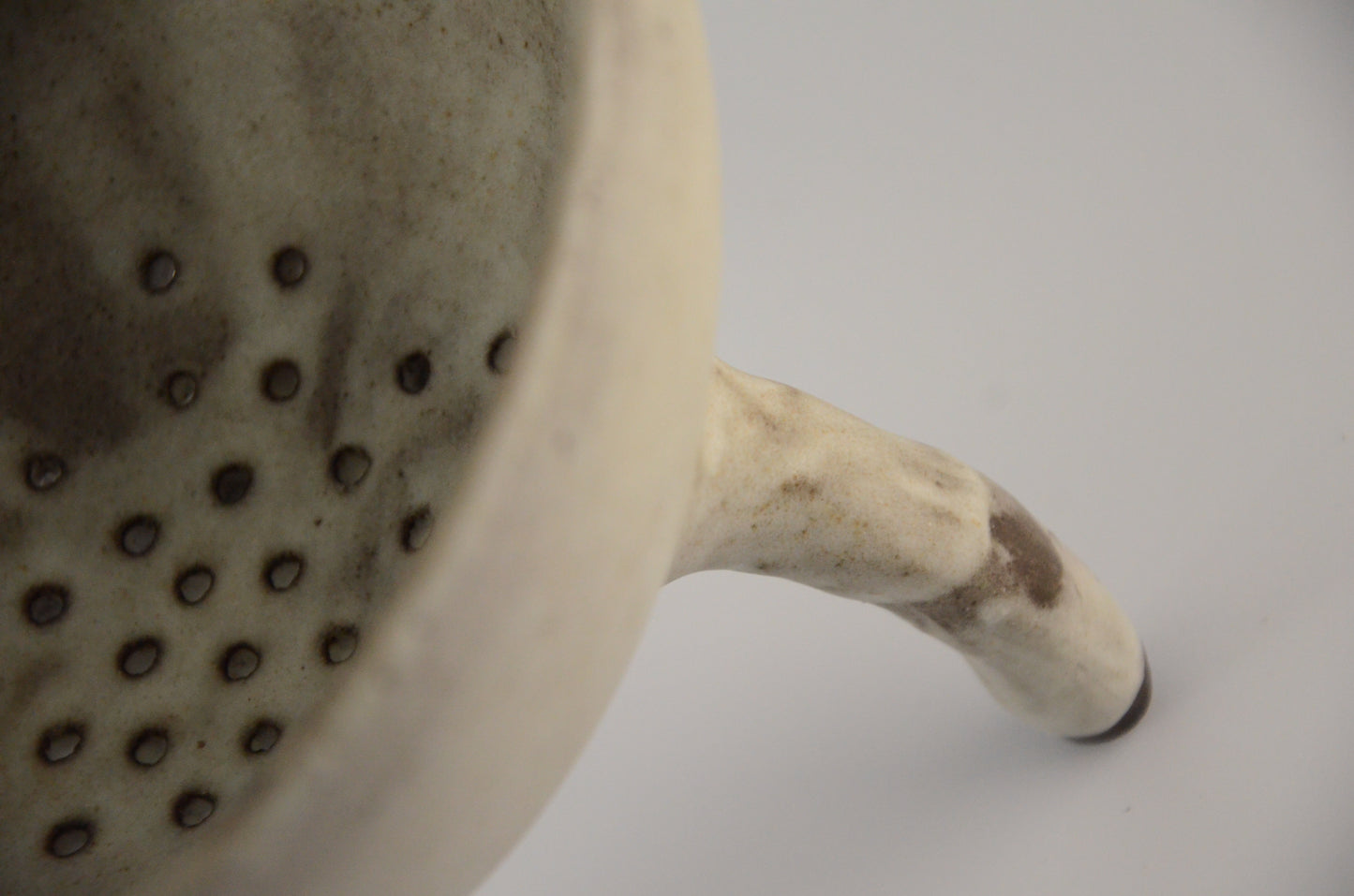 White ceramic strainer