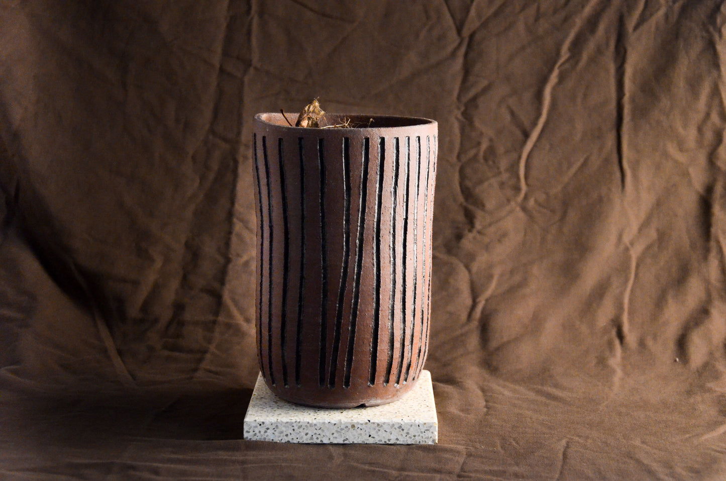 Brown cylinder textured planter